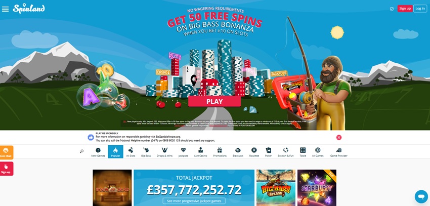 Spinland casino homepage showing its city-of-chips theme artwork